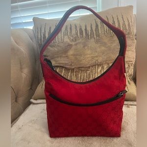 Red Gucci bag with leather strap